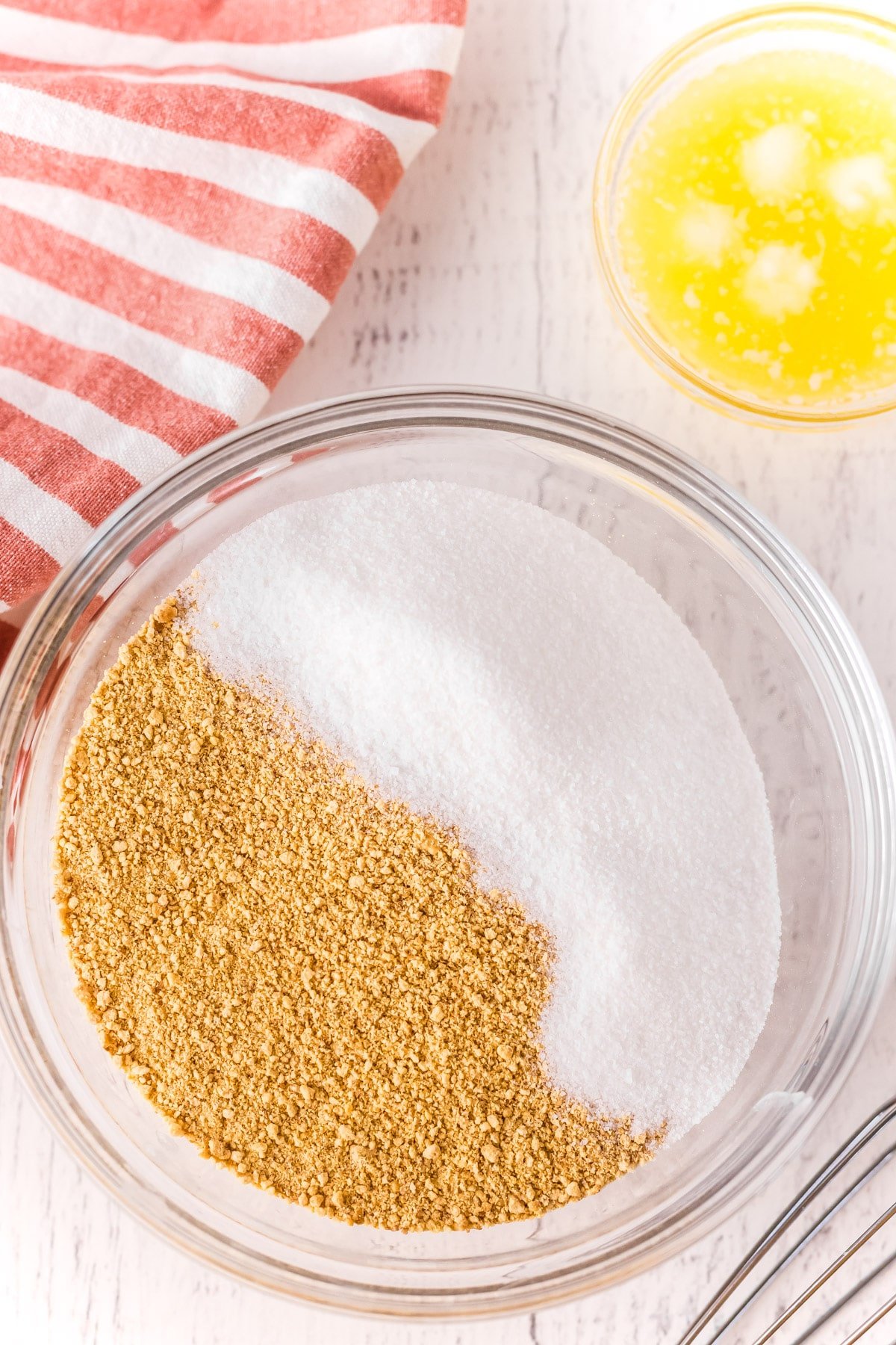 Bowl with graham cracker crumbs, sugar, and melted butter