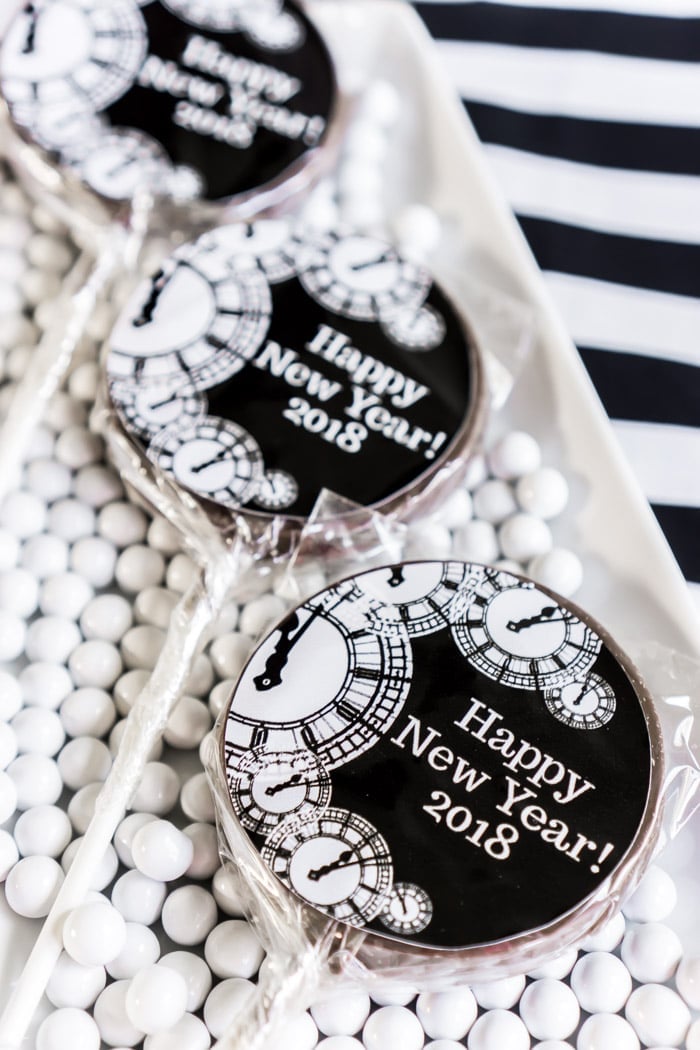 Black and white themed cookies on a stick