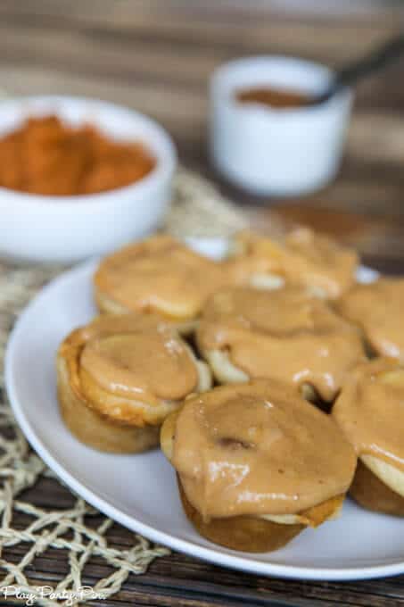 Make these easy mini pumpkin rolls in just a few minutes by using refrigerated crescent rolls and a few extra ingredients. One of the best fall desserts and perfect for a fall brunch food! 