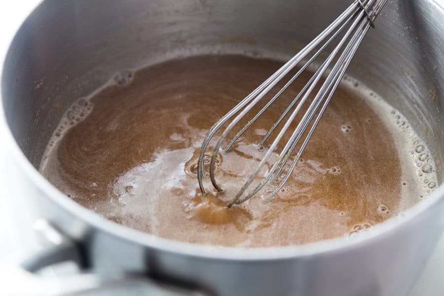 Stirring ingredients for a peanut dipping sauce