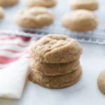 A stack of chewy molasses cookies showing how thick and fluffy they are