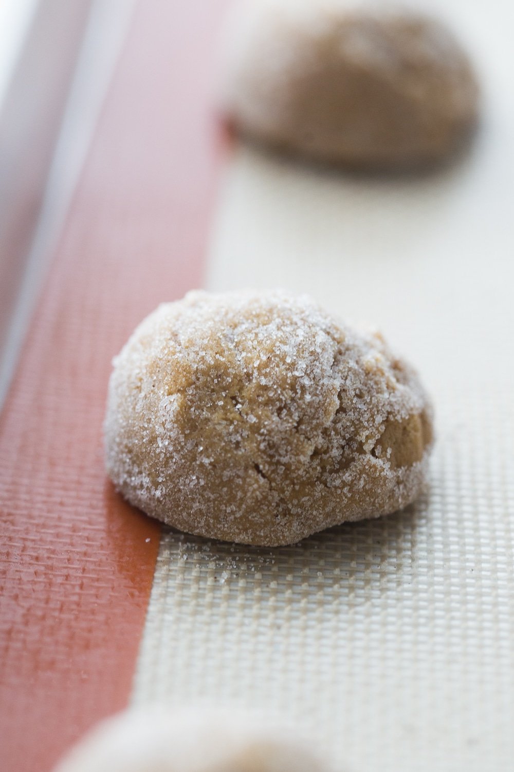 Chewy molasses cookies on a baking sheet ready to be baked