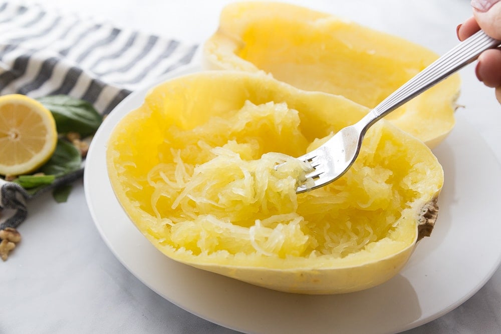 Fork scraping insides of spaghetti squash