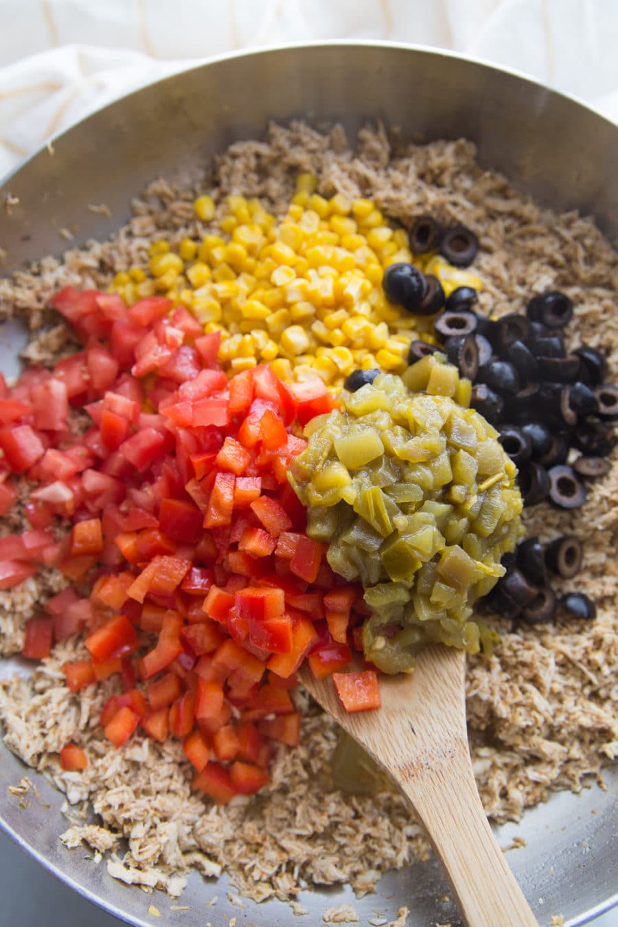 Mixing the filling for white chicken enchiladas