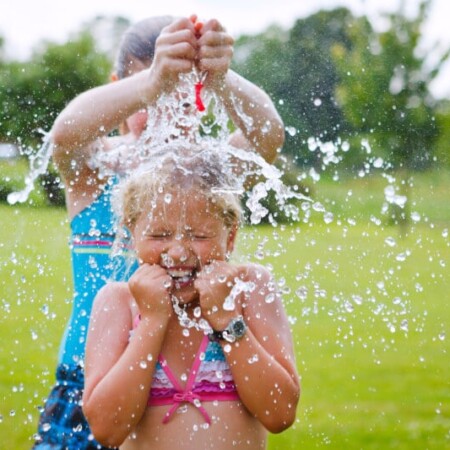 Fifteen of the best outdoor water games for kids that are fun enough they’d be perfect for teens or for adults too! Play them for birthday parties, when you’re at camp this summer, or even during a backyard BBQ!
