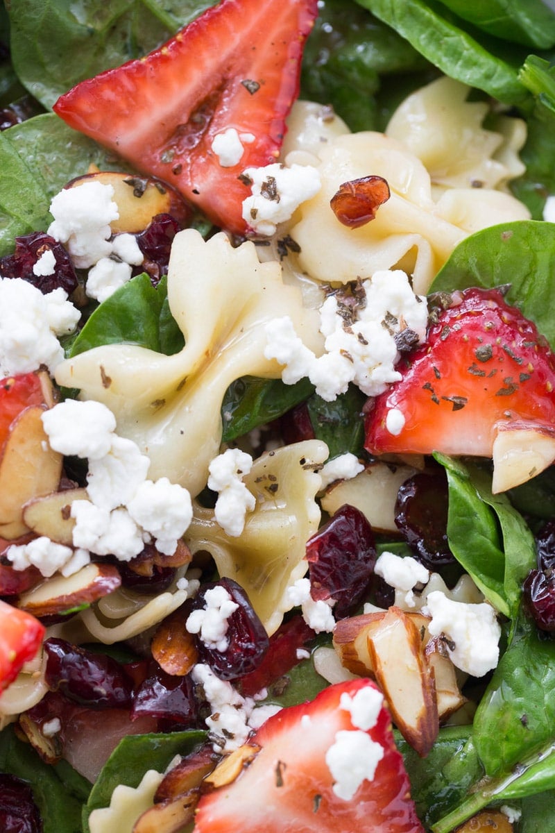 A close-up of strawberry spinach salad