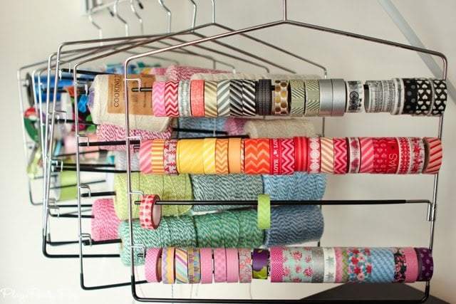 Store washi tape, ribbon, twine, etc. on pants holders, great idea from playpartyplan.com