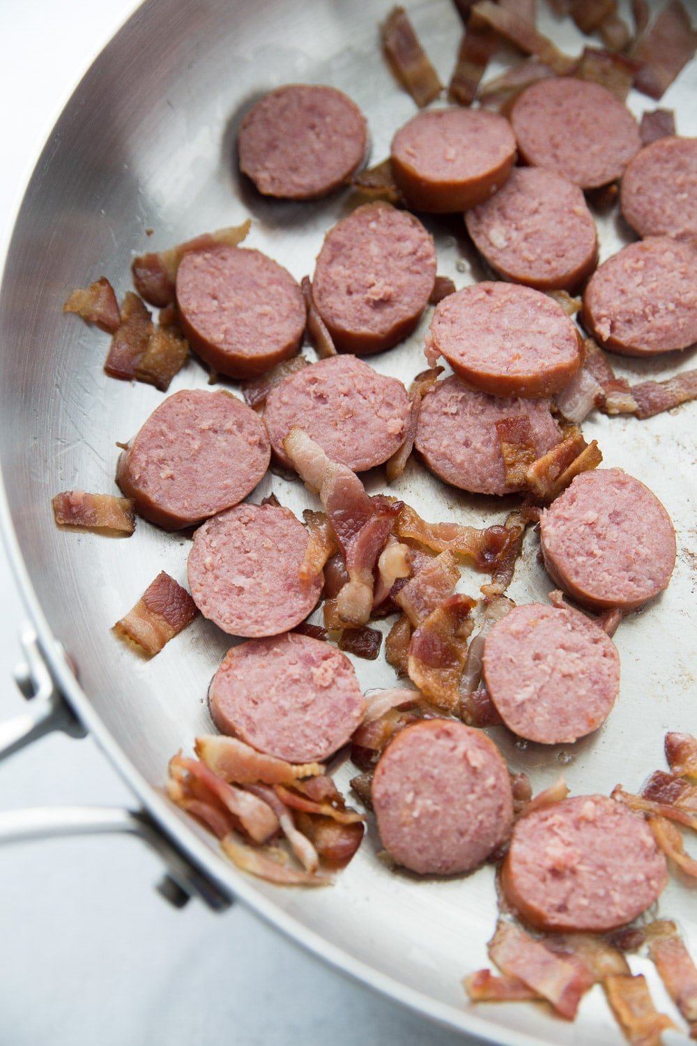 Bacon and sausage cooking for feijoada