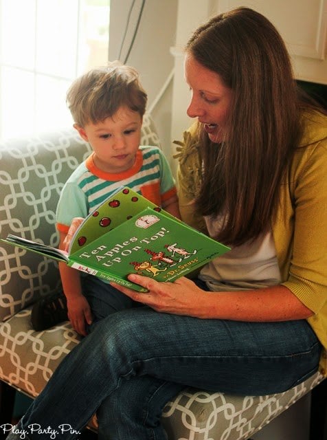 mother reading a book to her child