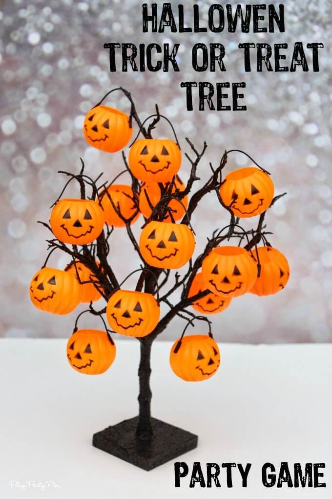 Pumpkins filled with "tricks" and treats. Such a fun idea for a Halloween party game idea or a Halloween countdown calendar for kids, includes free printable "tricks" and Halloween activities 