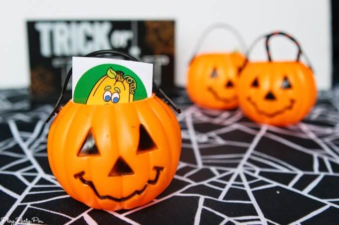 Kids will love this Halloween party game idea where they pick a pumpkin with a trick or treat inside 