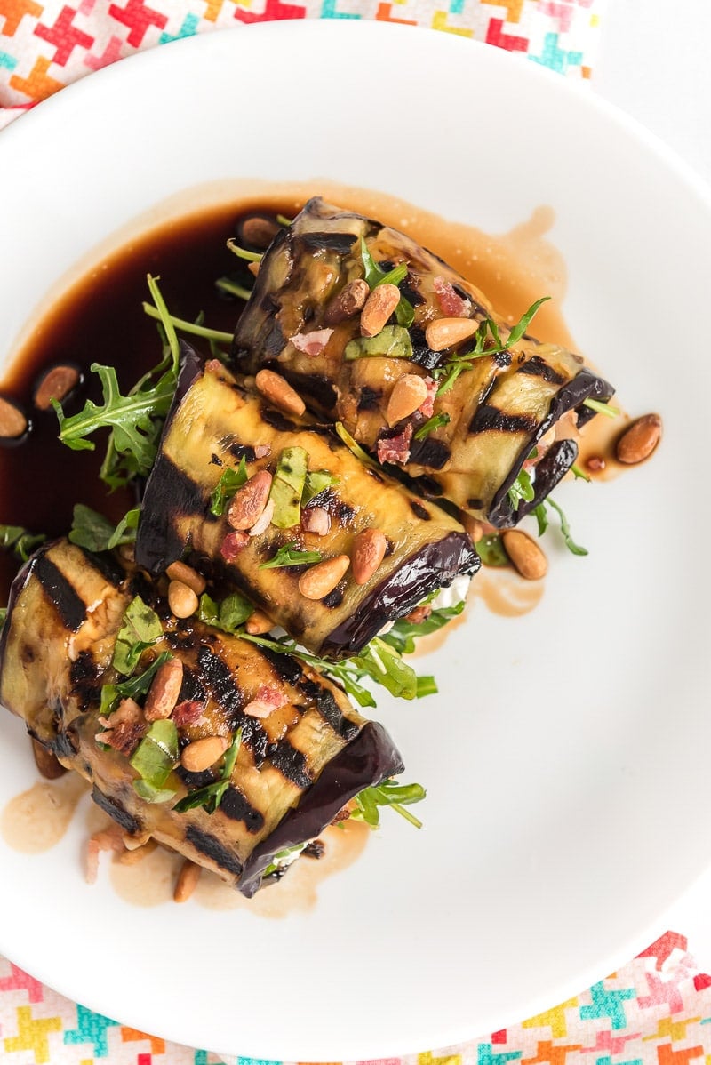 Top down image of eggplant rolls on a plate