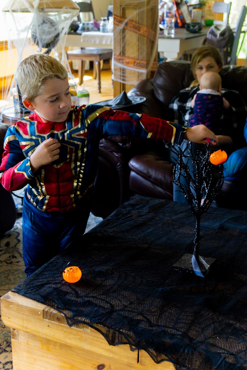 Kid playing a trick or treat game