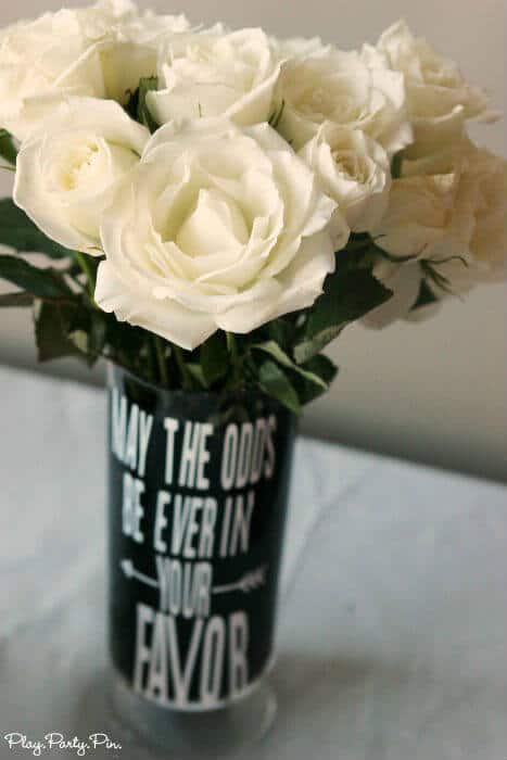 Hunger Games vase with white roses, perfect for a Hunger Games party