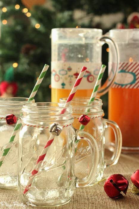 Mason jar mugs tied with baking twine and a little jingle bell, perfect for holiday drinks