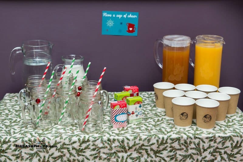Christmas party drink station, love the have yourself a cup of cheer sign 