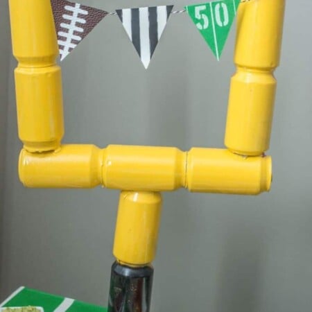 Love the idea of using empty soda cans to make a field goal post, perfect for Super Bowl party decorations!