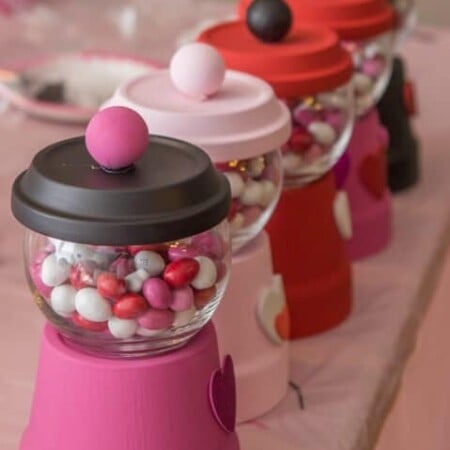 Valentine's Day bubble gum machines are such cute Valentine's Day crafts and perfect for this fun craft your heart out Valentine's Day party from www.playpartyplan.com.