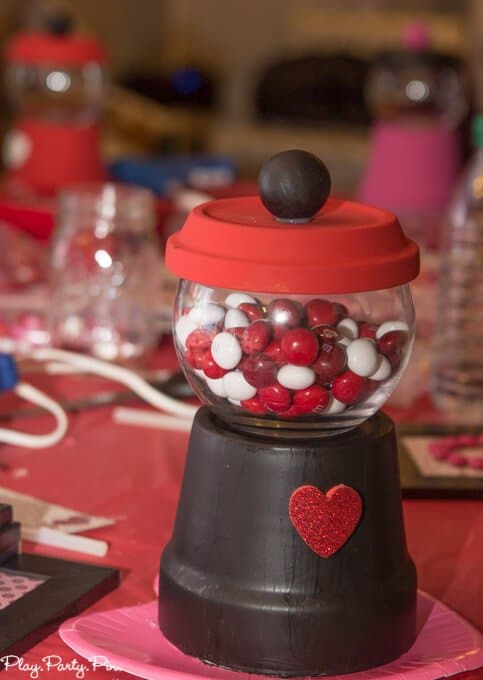 Valentine's Day bubble gum machines are such cute Valentine's Day crafts and perfect for this fun craft your heart out Valentine's Day party from www.playpartyplan.com.