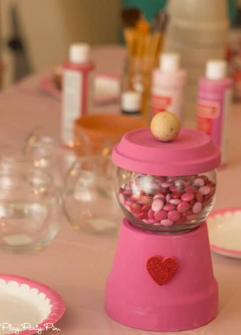 Valentine's Day bubble gum machines are such cute Valentine's Day crafts and perfect for this fun craft your heart out Valentine's Day party from www.playpartyplan.com.