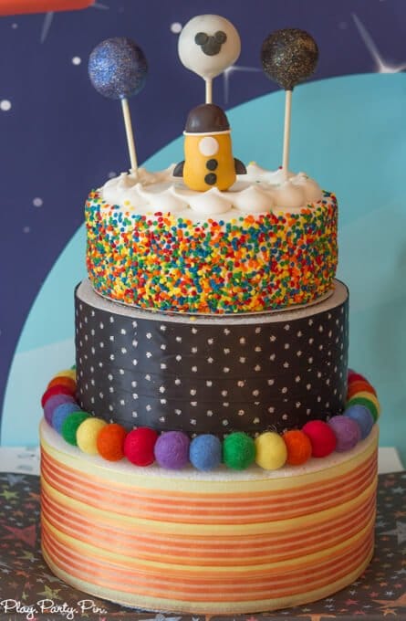 Outer Space party cake, love those planet and rocket cake pop toppers!