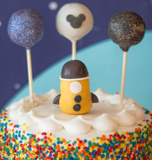 Outer Space party cake, love those planet and rocket cake pop toppers!