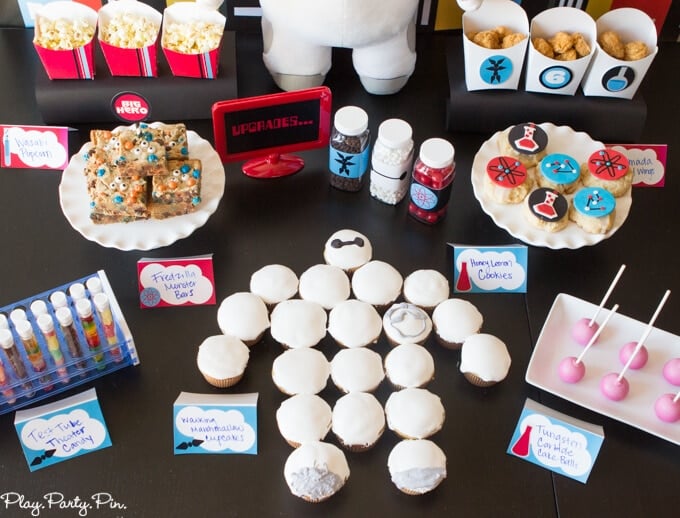 All sorts of fantastic Big Hero 6 party ideas including the easiest Baymax cupcake cake, awesome Fredzilla monster bars, and honey lemon cookies! Love everything about this Big Hero 6 movie night from www.playpartyplan.com. 