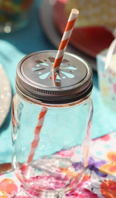 Gorgeous spring tablescape ideas, love the fabrics and jelly bean vases and napkin rings