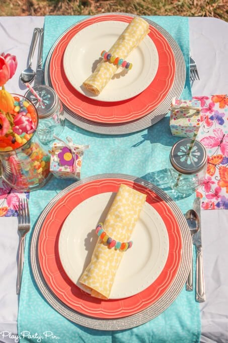 Gorgeous spring tablescape ideas, love the fabrics and jelly bean vases and napkin rings