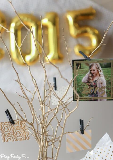 Love this idea of doing a gold foil inspired graduation advice tree, perfect to show off graduation announcements and get advice and congratulations!