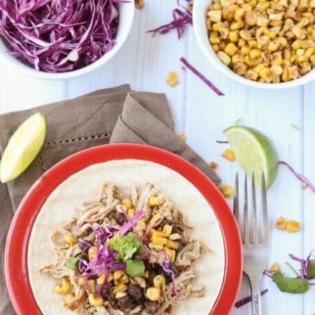 The most amazing pork taco recipe with a crockpot shredded pork and honey citrus cabbage