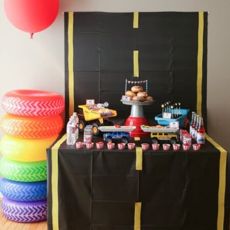 What a cute party table setup for a things that go party or pop a wheelie party, love the idea of creating a road on the table!
