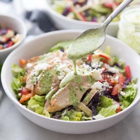 Pouring dressing on southwestern chicken salad