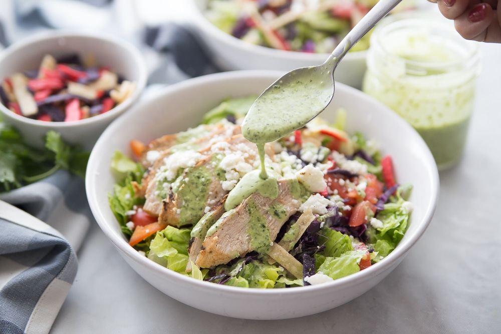 Pouring dressing on southwestern chicken salad