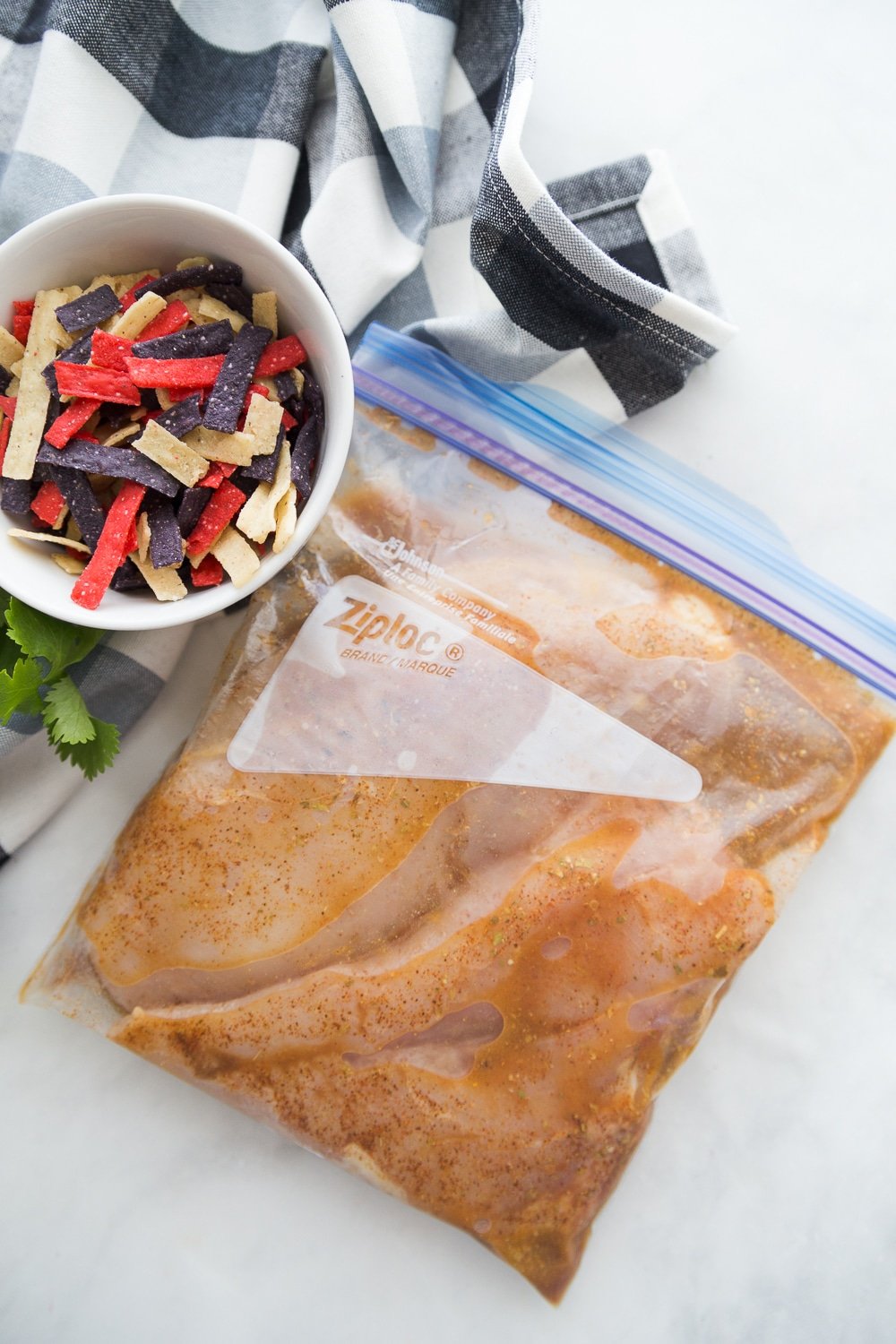 Chicken marinating in a bag for southwestern chicken salad