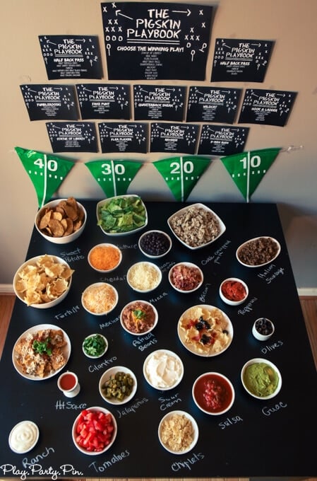 Love this DIY nacho bar with free printables for a football party, how fun are those football playbook printables?