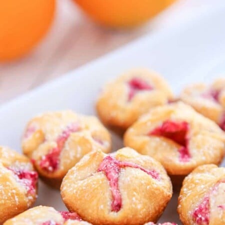These mini cranberry orange bites take just a few minutes to make and make great appetizers or desserts for a baby shower, a great addition to your menu of Thanksgiving recipes, or even just a hostess gift to give to someone who’s hosting Thanksgiving! They’re the perfect easy desserts or if you’re not sharing, the perfect breakfast food!