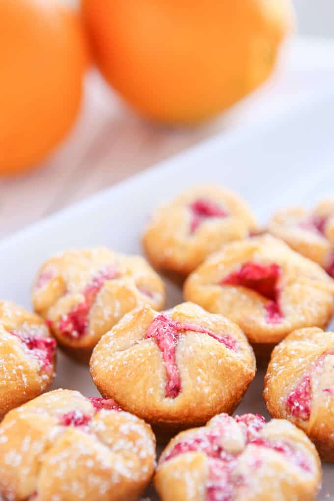 These mini cranberry orange bites take just a few minutes to make and make great appetizers or desserts for a baby shower, a great addition to your menu of Thanksgiving recipes, or even just a hostess gift to give to someone who’s hosting Thanksgiving! They’re the perfect easy desserts or if you’re not sharing, the perfect breakfast food! 