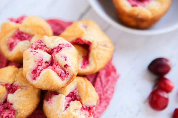 These mini cranberry orange bites take just a few minutes to make and make great appetizers or desserts for a baby shower, a great addition to your menu of Thanksgiving recipes, or even just a hostess gift to give to someone who’s hosting Thanksgiving! They’re the perfect easy desserts or if you’re not sharing, the perfect breakfast food! 