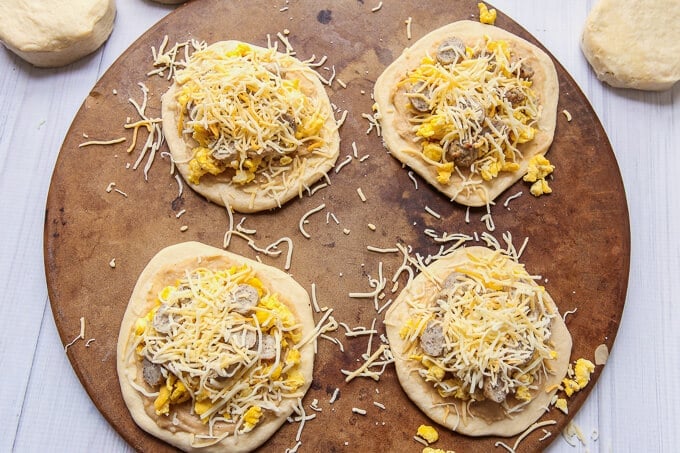 These biscuit and gravy breakfast pizzas are a super easy recipe and a perfect way to combine your favorite breakfast flavors into one recipe! They’d also make one yummy and easy dinner recipe. I’m definitely trying these with some maple syrup drizzled on top! 