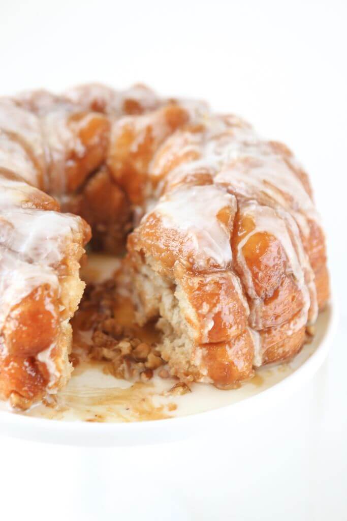 This pineapple monkey bread recipe is perfect for Easter brunch or even for a dessert on a baby shower dessert table! Since you make this monkey bread with canned biscuits and pineapple juice, it’s an easy monkey bread recipe that everyone can make! Definitely one of my favorite recipes for a pineapple cake and one of the easiest desserts or breakfast recipes ever!