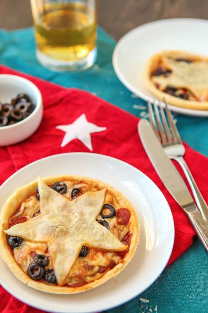 These mini pizza pies are perfect for anyone who loves Gilmore Girls, pizza, or pie! Your favorite pizza toppings baked into a pie crust makes these almost like a pie version of your favorite pizza rolls. Such an easy pizza pie recipe and I love the Stars Hollow star on top! Definitely adding this to my easy appetizers board! 