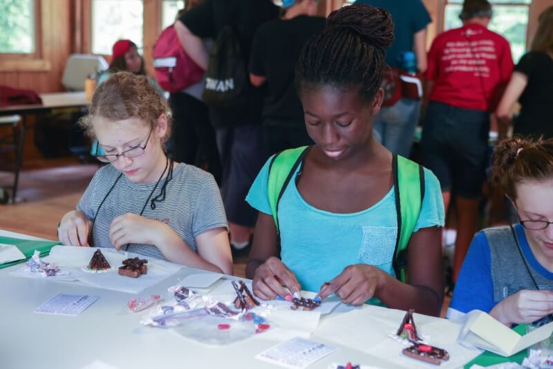 Girls building a candy campfire