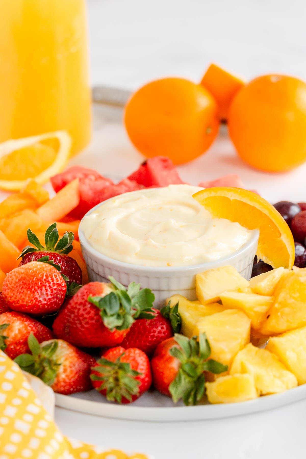 fruit tray with a bowl of fruit dip