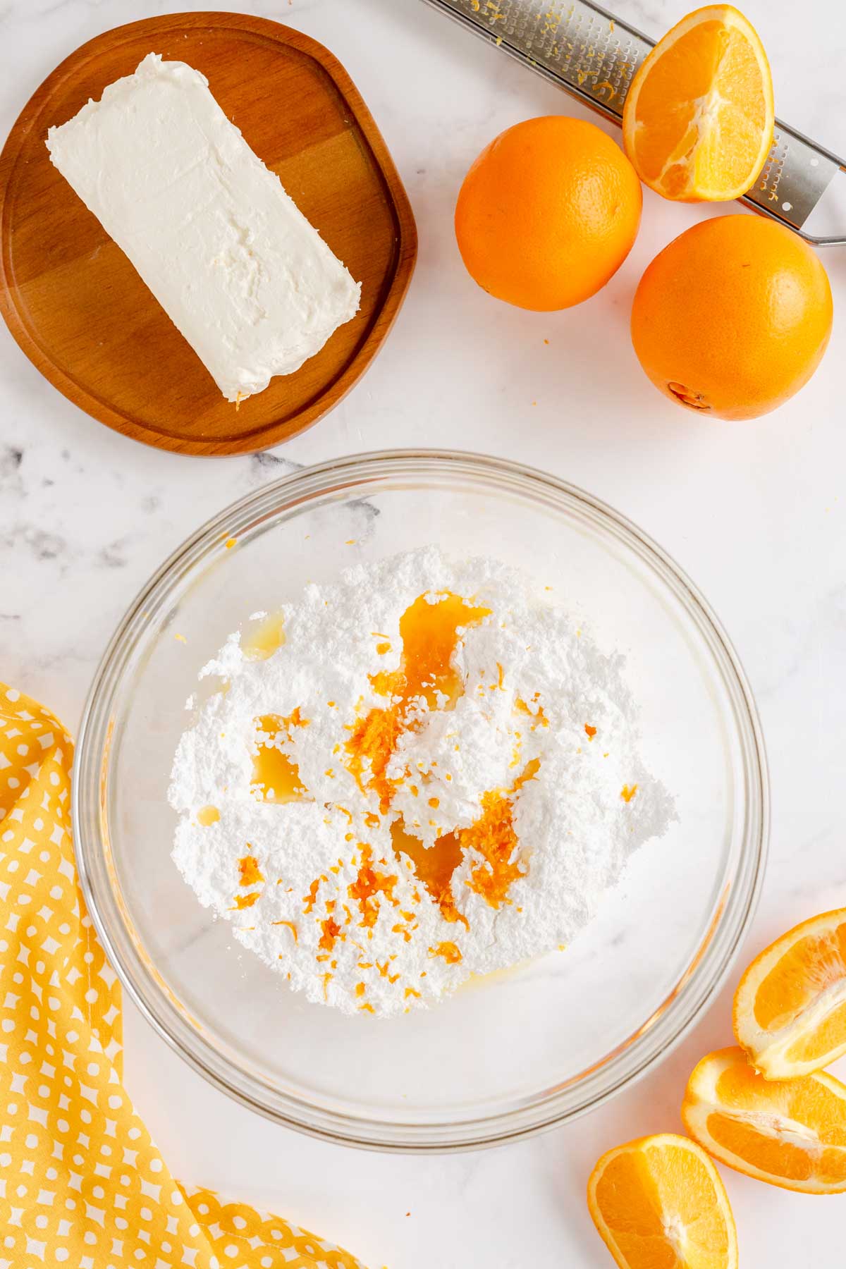 bowl with orange juice, zest, and sugar