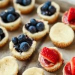 This red, white, and blue mini cheesecake recipe is the perfect 4th of July dessert or Memorial Day treat, a protein packed crust topped with a sweet cream cheese topping.