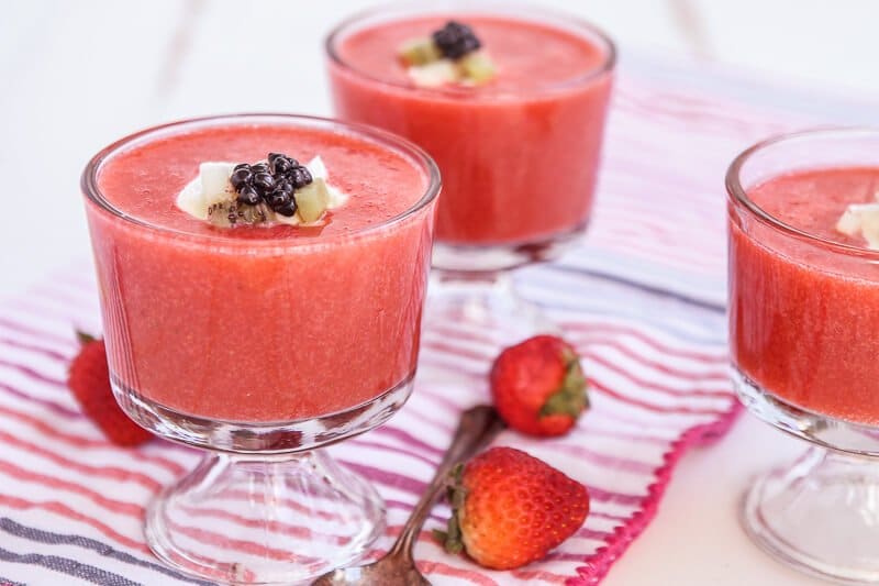 This strawberry soup tastes almost like a melted smoothie except better. Such a simple and easy recipe that uses fresh strawberries to create a healthy dessert option. Definitely one of the most unique strawberry ideas and perfect for summer entertaining! 