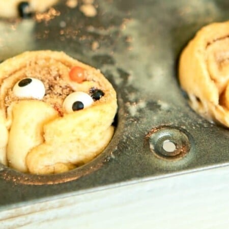 These monster inspired mini cinnamon rolls are the perfect monster food for Halloween! Start with Pillsbury crescents and turn them into something that both kids and adults will love. They’re great for a party, for Halloween breakfast, or when you want something homemade but don’t have time to make cinnamon rolls from scratch. I love the fun little surprises inside.