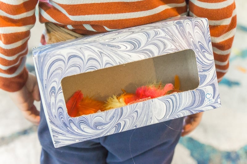 A tissue box full of feathers for Thanksgiving family games