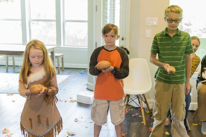 Kids playing Thanksgiving games with their family